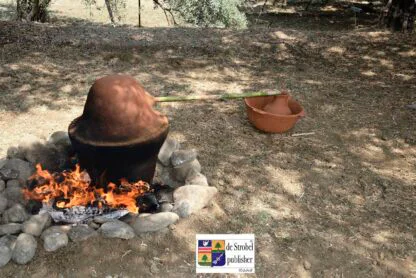 illustrates ancient distillation process with fireplace and molar prototype of alembic